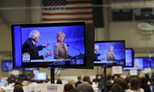 U.S. Democratic presidential candidates Hillary Clinton and Bernie Sanders appear on television screens in the media work-room during the Democratic presidential candidates debate at Saint Anselm College in Manchester N.H. on Dec. 19 2015. /Reuters