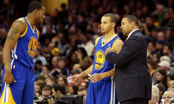 CLEVELAND OH- DECEMBER 29 Head coach Mark Jackson of the Golden State Warriors speaks to Andre Iguodala #9 and Stephen Curry #30 of the Golden State Warriors in the fourth quarter against the Cleveland Cavaliers at Quicken Loans Arena