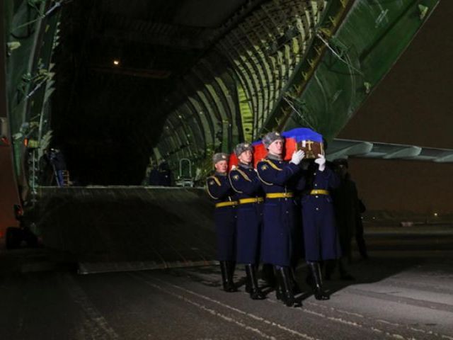 30 2015 and obtained from the Russian Defence Ministry's official website shows Russian honor guards carrying the coffin with the body of Russian pilot Lt. Col. Oleg Peshkov out of a plane during a ceremony near Moscow