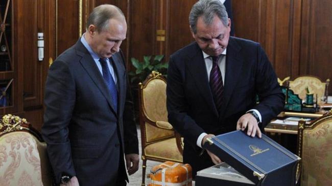 Russian Defense Minister Sergey Shoygu shows President Vladimir Putin a flight recorder from the Russian warplane shot down by a Turkish jet last month in the Novo Ogaryovo residence outside Moscow Russia