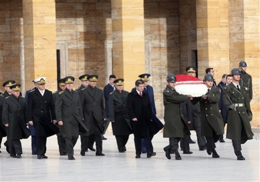 Turkey mausoleum Turkish Prime Minister Ahmet Davutoglu center-right and army commanders walk to the mausoleum of Turkey's founder Mustafa Kemal Ataturk before a meeting of High Military Council in Ankara Turkey Thursday Nov. 26 2015. Turkey shot