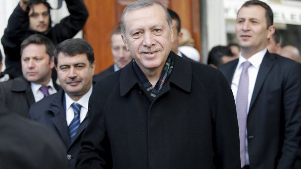 Turkish President Tayyip Erdogan smiles as he leaves from Eyup Sultan mosque in Istanbul Turkey