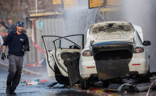 The scene of a car-ramming attack by a Palestinian driver at a Jerusalem bus stop that injured 11 people waiting there Dec. 14 2015