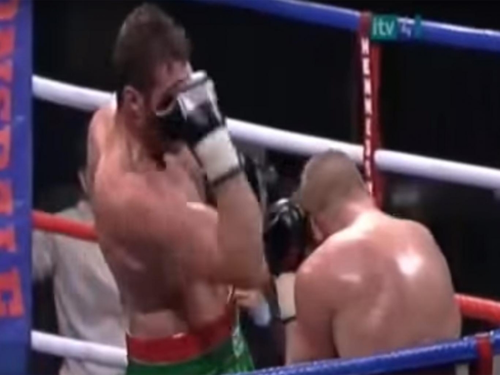 Tyson Fury punches himself in the face during a bout against Lee Swaby in 2009. YouTube