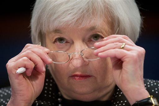 Federal Reserve Chair Janet Yellen removes her glasses as she testifies on Capitol Hill in Washington. The Federal Reserve is widely expected to raise its key rate from record lows on Wednesday Dec. 16 2015 potential