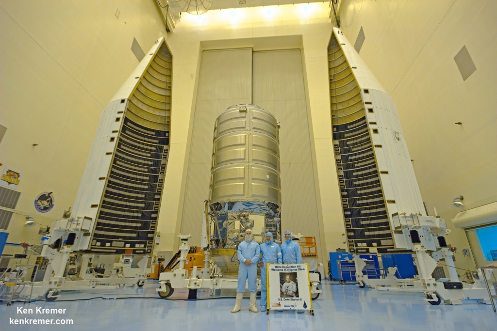 Inside the Payload Hazardous Servicing Facility high bay clean room at NASA's Kennedy Space Center in Florida where the Orbital ATK Cygnus pressurized module is being processed for Dec. 3 2015 launch Dan Tani former astronaut and now Orbital ATK