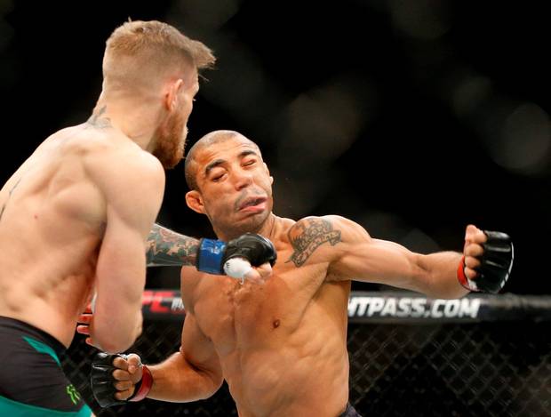 Conor McGregor left fights Jose Aldo during a featherweight championship mixed martial arts bout at UFC 194 Saturday Dec. 12 2015 in Las Vegas. Mc Gregor stopped Aldo with one spectacular punch just 13 seconds into the first round Saturday night bac