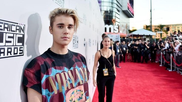 Christmas spirit... Justin Bieber seen here at the 2015 American Music Awards in November wanted to be beaten to the UK no.1