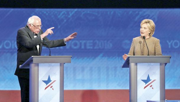 Bernie Sanders left and Hillary Clinton speak during an exchange during the Democratic presidential primary debate Saturday at Saint Anselm College in Manchester N.H