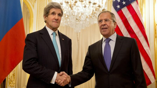 U.S. Secretary of State John Kerry left shakes hands with Russian Foreign Minister Sergey Lavrov in Paris in March. Kerry will meet with Lavrov and Putin in Sochi Russia May.12,2015