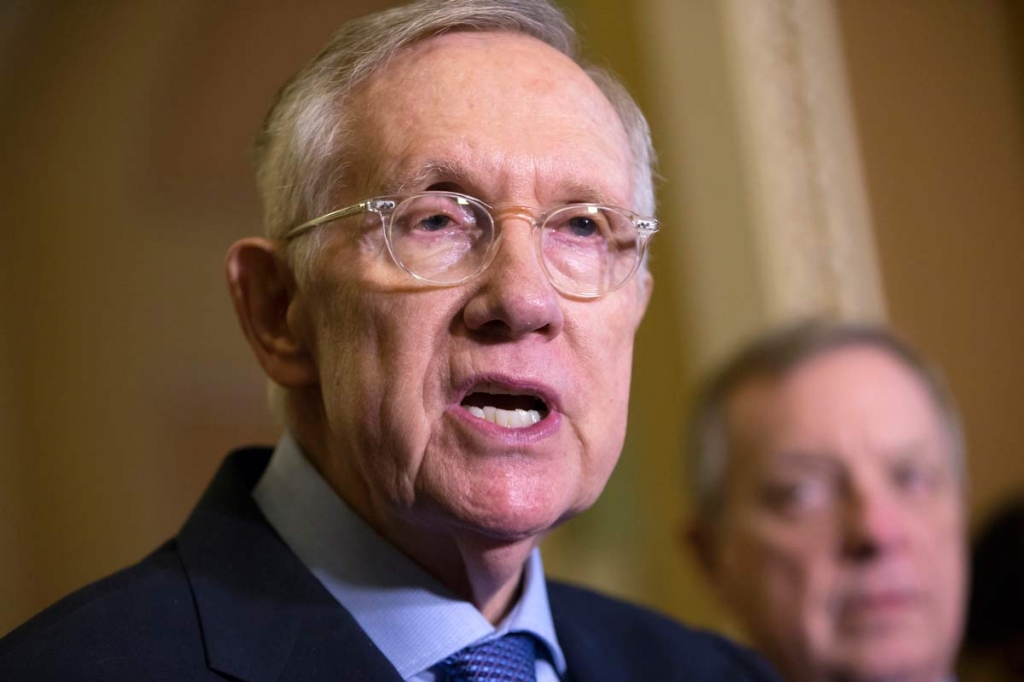 Senate Minority Leader Harry Reid of Nev. left joined by Senate Minority Whip Richard Durbin of Ill. right speaks with reporters following a weekly policy meeting on Capitol hill in Washington