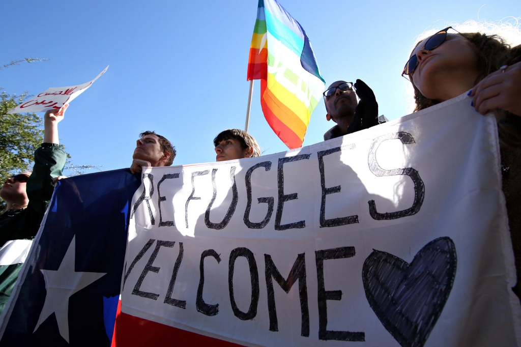 Demonstrators gathered near the state Capitol earlier this month in protest of the Governor's statement to block the resettlement of Syrian refugees in Texas