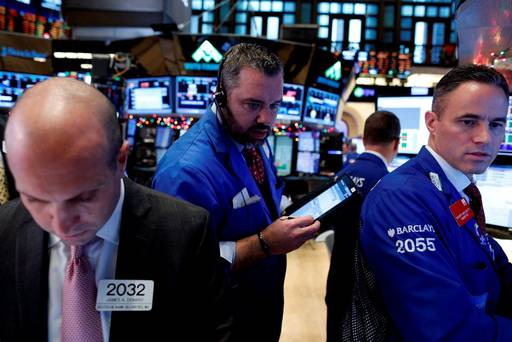 Traders work on the floor of the New York Stock Exchange