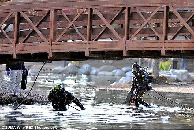 Unidentified items were pulled from the lake during a three-day search. Above dive team members search near a bridge in the park