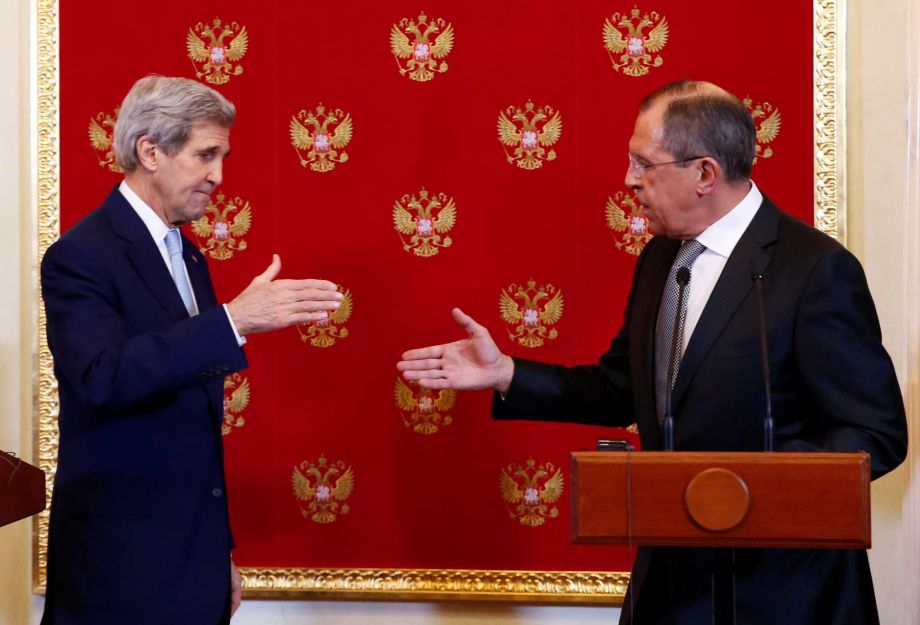 US Secretary of State John Kerry left and Russia's Foreign Minister Sergey Lavrov shake hands after their joint press conference at the Kremlin Tuesday Dec. 15 2015 in Moscow. Earlier in talks with Russian Foreign Minister Sergey Lavrov Kerry