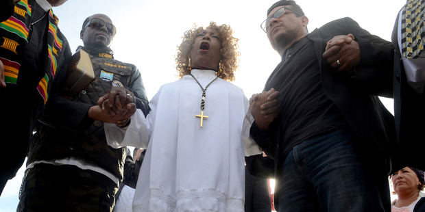 Loading Dr. Jeannetta Million of Victorious Believers Church leads a group of local pastors in a brief prayer vigil