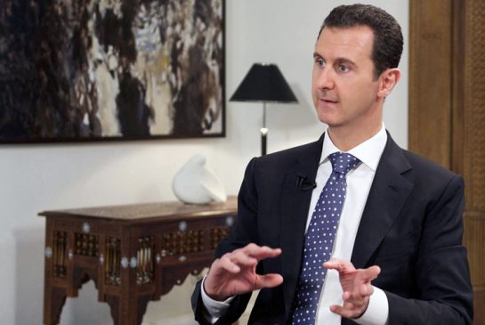 Syrian official news agency SANA shows Syrian President Bashar Assad speaking during an interview with the Spanish news agency EFE in Damascus Syria Friday Dec. 11 2015