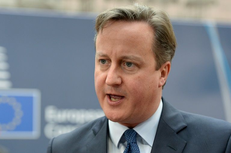 Britain's Prime Minister David Cameron speaks to the media as he arrives at the European Council in Brussels