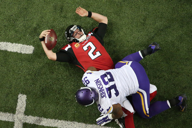 Vikings defensive lineman Tom Johnson sacked Falcons quarterback Matt Ryan. John Bazemore  AP Click