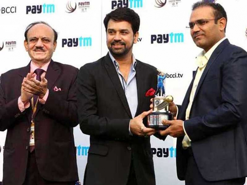 Virender Sehwag being felicitated by Board of Control for Cricket in India secretary Anurag Thakur in Feroz Shah Kotla