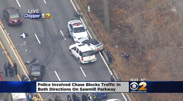 A fleeing gunman apparently slammed his car into a pursuing police car and ran out on foot on the Saw Mill River Parkway