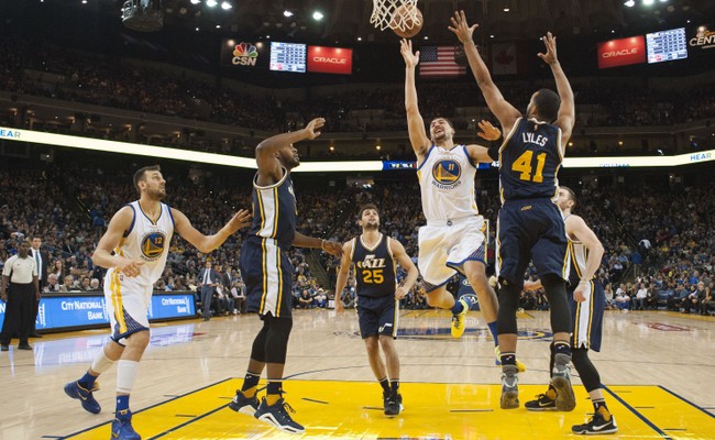 Oakland CA USA Golden State Warriors guard Klay Thompson shoots the basketball against Utah Jazz forward Trey Lyles during the third quarter at Oracle Arena. The Warriors defeated the Jazz 103-85. Mandatory Credit Kyle Ter