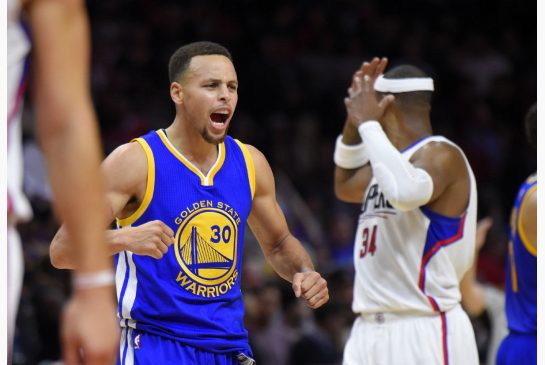 Golden State Warriors guard Stephen Curry left celebrates near Los Angeles Clippers forward Paul Pierce during the second half of an NBA basketball game Thursday Nov. 19 2015 in Los Angeles. The Warriors won 124-117