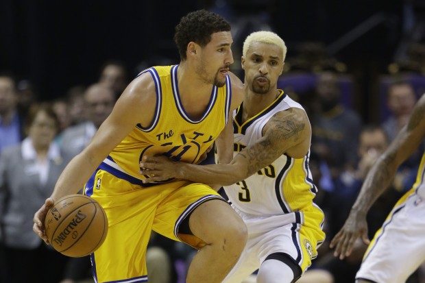 Indiana Pacers guard George Hill tries to tie up Golden State Warriors guard Klay Thompson during the second half of an NBA basketball game in Indianapolis Tuesday Dec. 8 2015. The Warrior defeated the Pacers 131-123