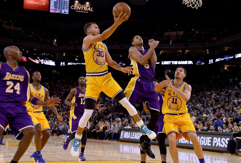 Getty Images  AFP  Thearon W. Henderson Stephen Curry of the Golden State Warriors shoots over Jordan Clarkson of the Los Angeles Lakers during their NBA basketball game at ORACLE Arena