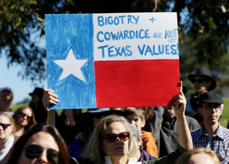 Members of The Syrian People Solidarity Group protest Texas Gov. Greg Abbott's refusal to allow Syrian refugees in the state on Nov. 22 2015 in Austin