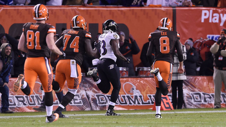 Will Hill is chased down in vain by Browns defenders as he returns a blocked kick for the winning touchdown