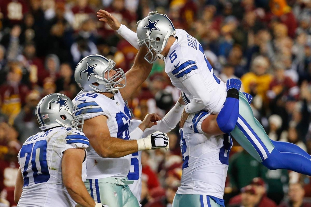 Dallas Cowboys kicker Dan Bailey celebrates with his teammates after kicking the game-winning field goal during the second half of an NFL football game against the Washington Redskins in Landover Md. Monday Dec. 7 2015