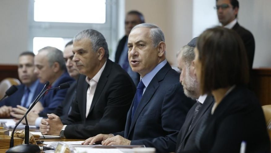 Israel's Prime Minister Benjamin Netanyahu center speaks during the weekly cabinet meeting in Jerusalem Sunday Dec. 13 2015