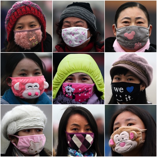 Women wear masks to protect from air pollutants in Beijing