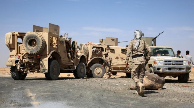 Armed Yemeni tribesmen from the Popular Resistance Committees hold a position in the area of Sirwah west of Marib city