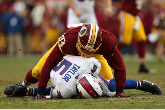 Bills quarterback Tyrod Taylor is sacked by Washington linebacker Preston Smith in the fourth quarter of Buffalo's loss Sunday. The Bills will miss the playoffs for the 16th straight year