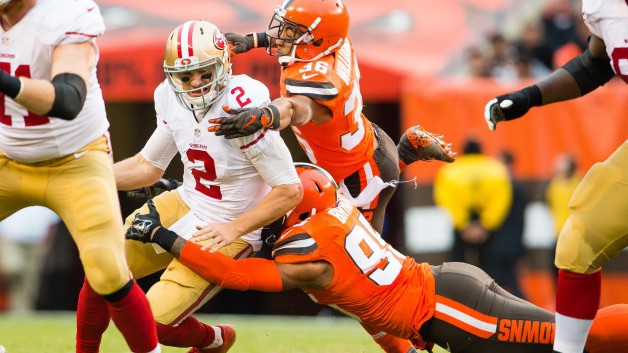 CLEVELAND OH- DECEMBER 13 Quarterback Blaine Gabbert #2 of the San Francisco 49ers is sacked by outside linebacker Armonty Bryant #95 and free safety K'Waun Williams #36 of the Cleveland Browns during the second half at First Energy Stadium on Dece