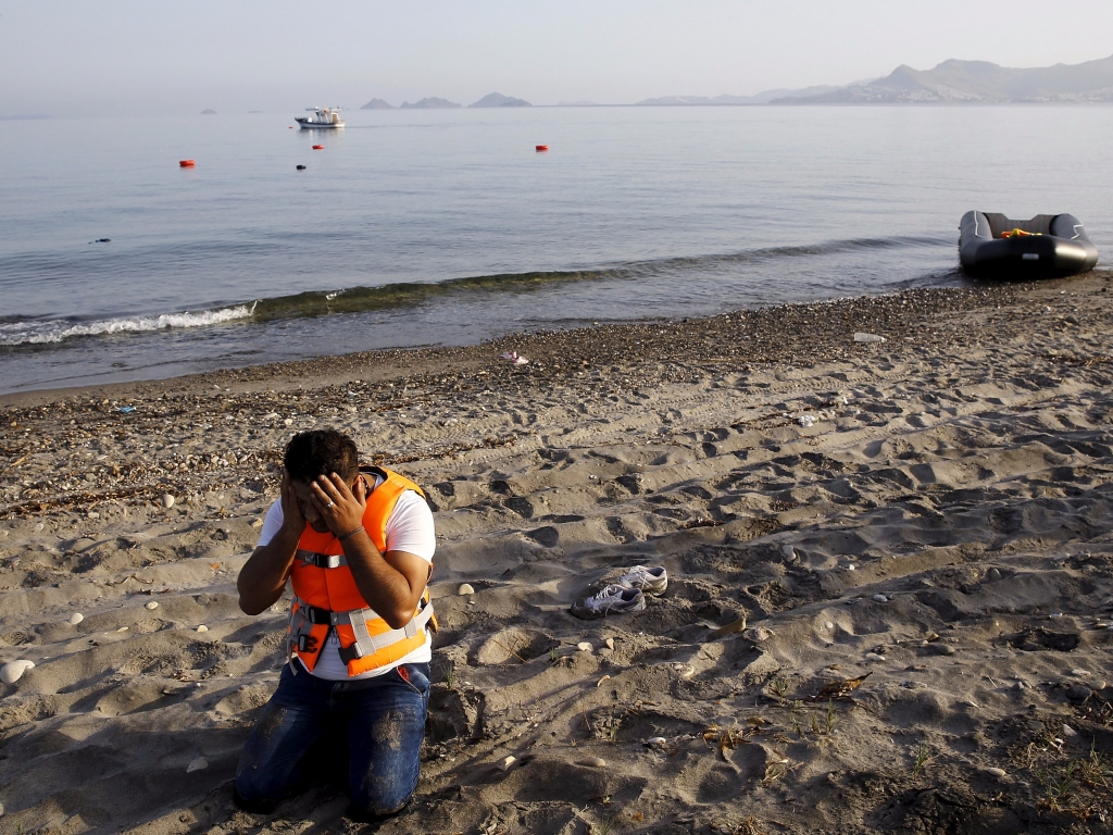 Syrian refugee praying