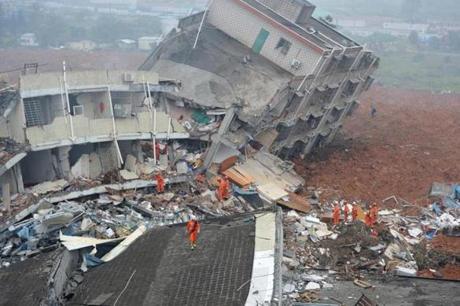 At least seven people were rescued after 18 buildings were buried and an area of 24,000 square yards was covered with soil in the southern China city of Shenzhen on Sunday