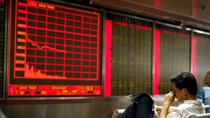 A Chinese investor monitors stock prices at at a brokerage house in Beijing on Aug. 24 2015. THE ASSOCIATED PRESS  Mark Schiefelbein