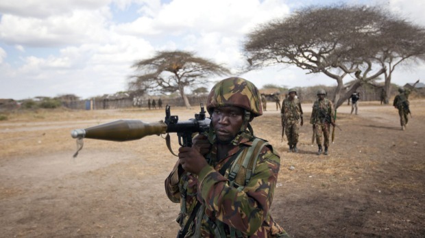 A Kenyan army soldier carries a rocket-propelled grenade launcher as he patrols Tabda Somalia