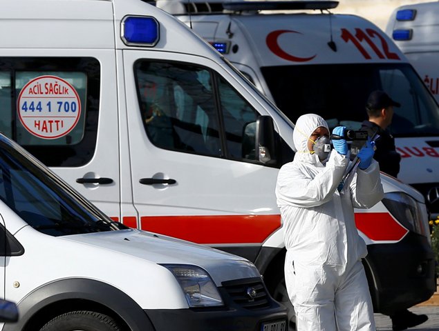 A Police forensic expert works on the scene of an explosion in central Istanbul Turkey