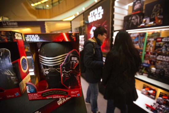 A couple looks at “Star Wars” merchandise for sale at a shopping mall in Beijing