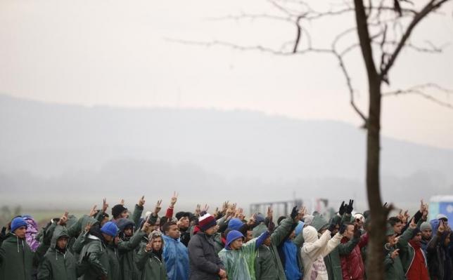 A group of migrants protests at the border with Greece near Gevgelija Macedonia