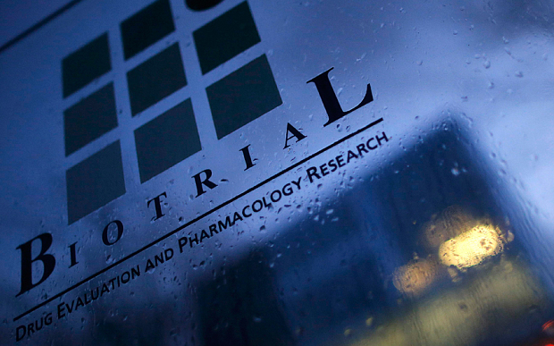 A logo is seen on a glass sign in front of the entrance of the Biotrial laboratory building in Rennes France