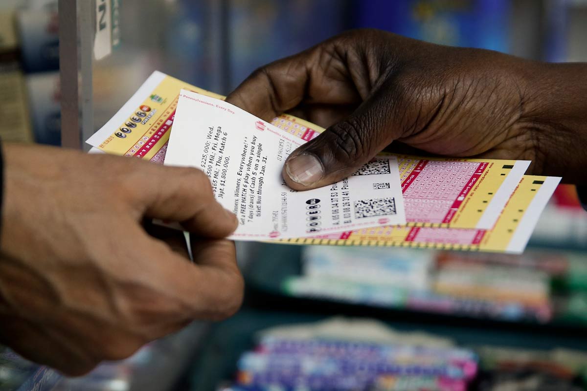 A person purchase Powerball lottery tickets from a newsstand Wednesday Jan. 6 2016 in Philadelphia. P