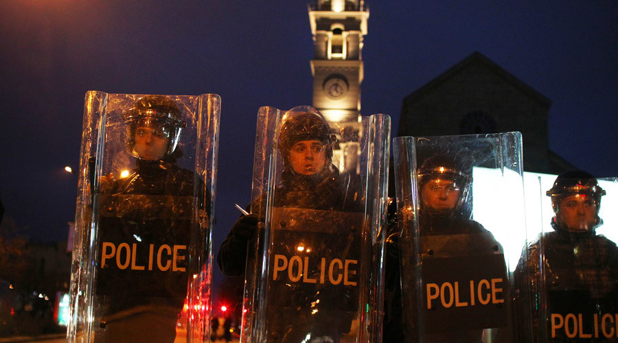 ARCHIVE Police hold shields during a demonstration by protesters in the centre of Pristina