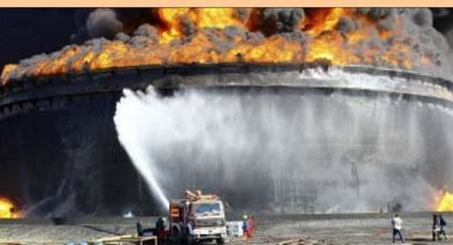 Ablaze an earlier fire at a tank in Sidra