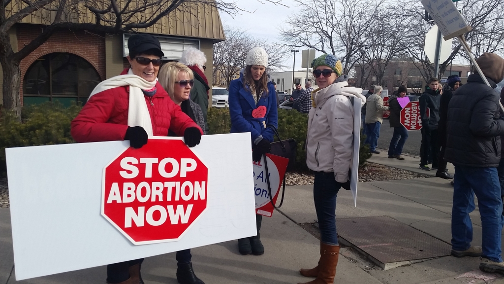 Kimberly resident Molly Arrossa holds a sign in front of Planned Parenthood in Twin Falls on Friday. She and others in the community came out to peaceably assemble on the anniversary of Roe v. Wade