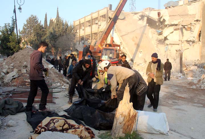 SYRIA-CONFLICT Bodies are placed inside bags after they were recovered from the rubble of destroyed buildings in Idlib in northwestern Syria